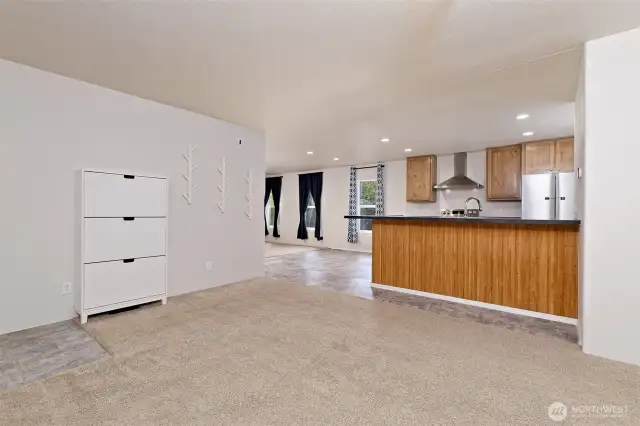 View to the kitchen/dining area and a peak at the second living room