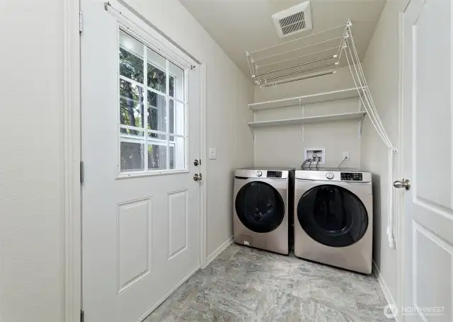 Very modern washer and dryer match the decor