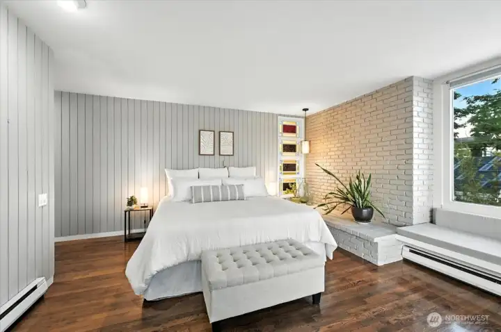 Generously sized Primary bedroom features premium placement for breathtaking, uninterrupted vistas of Puget Sound’s tranquil shoreline.