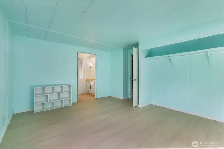 The primary bedroom looking into the primary bathroom