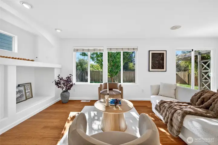 Main living area has abundant light and cozy gas fireplace