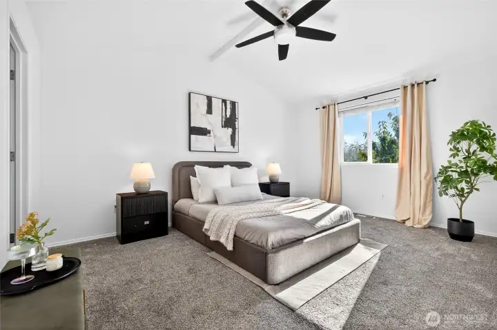 Primary suite has vaulted ceilings