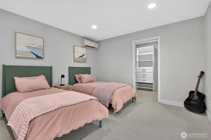 Both guest bedrooms upstairs have walk in closets. This Bedroom has particularly amazing views.