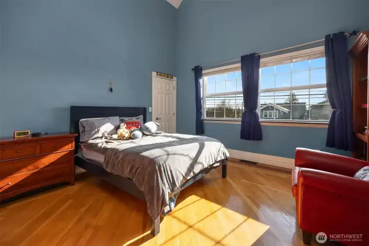 2nd bedroom upstairs with vaulted ceilings
