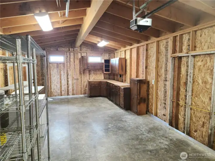 Garage deep enough to sustain one vehicle with a little more room for work space.  Plenty of cabinets to put your tools in.