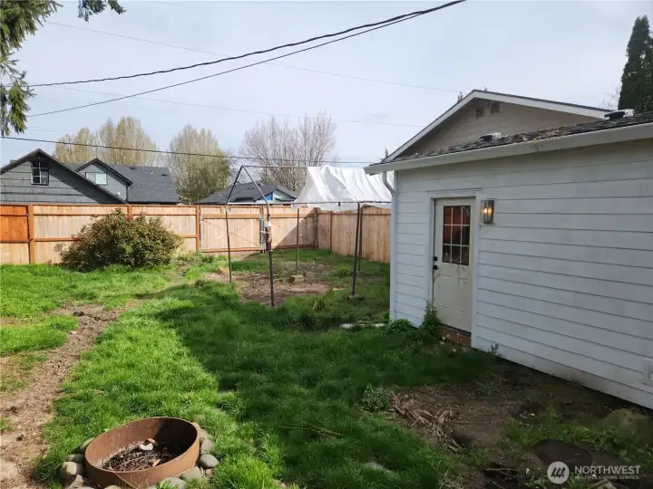Door which leads from garage to back yard. Fully fenced back yard with access from the alleyway out back.