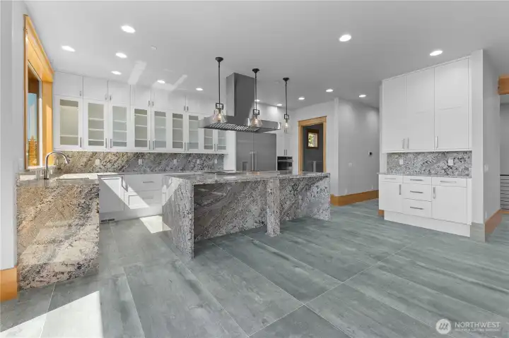 Custom cabinets to ceiling- soft close & tall granite countertops & huge waterfall breakfast bar.