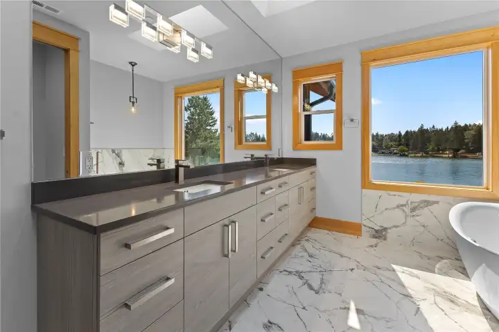 Primary Suite with double vanity and soaking tub. Also includes makeup bar with drawers PLUS full-length mirror