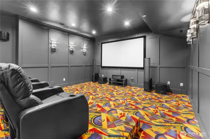 World-class theater with all the bells & whistles including rumble seats, woofers, sub-woofers, surround sound speakers, projector screen