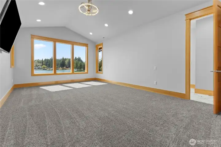 Primary Suite on 2nd floor with double-doors and built-in tv.