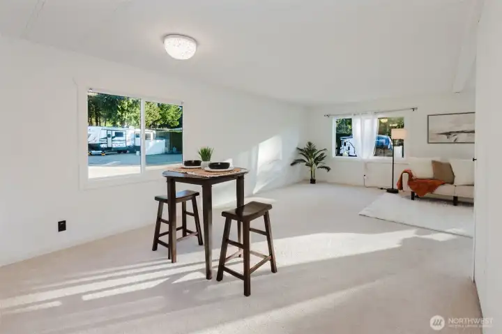 Additional view of the main living space highlighting its size, natural light, and open layout.