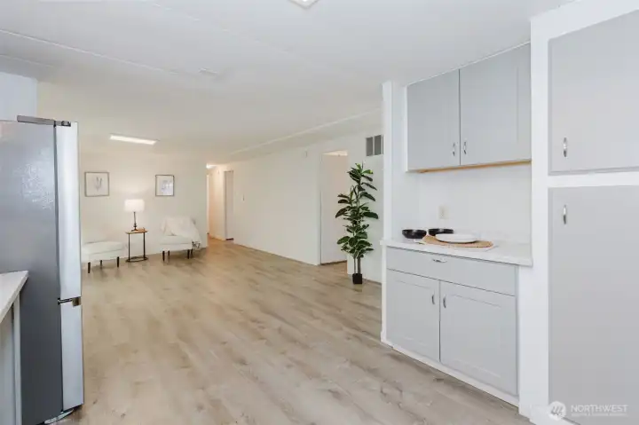 Seamless transition from kitchen to adjacent living space, creating an open and connected feel throughout the home.