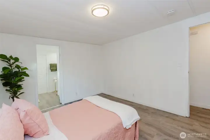 Additional view of the primary bedroom highlighting its size and flexible layout options.