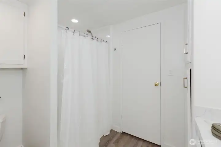 Bathroom with step-in shower and practical layout designed easy access.