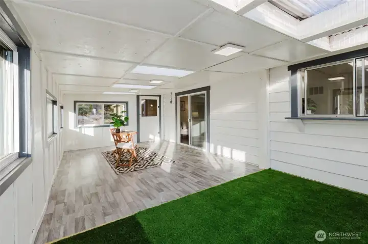 View of sunroom entry connecting seamlessly to the main home, enhancing overall living space.