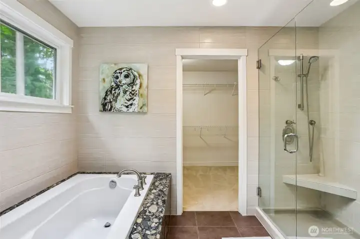 Primary Soaking Tub and Shower. View into Walk-in closet