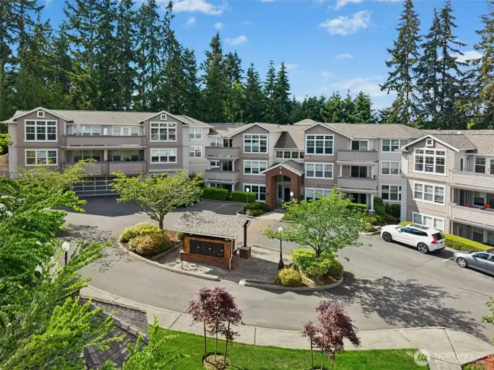 Serene community setting with mature landscaping.