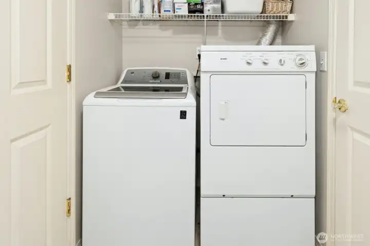 Laundry room located off kitchen & combined with pantry.