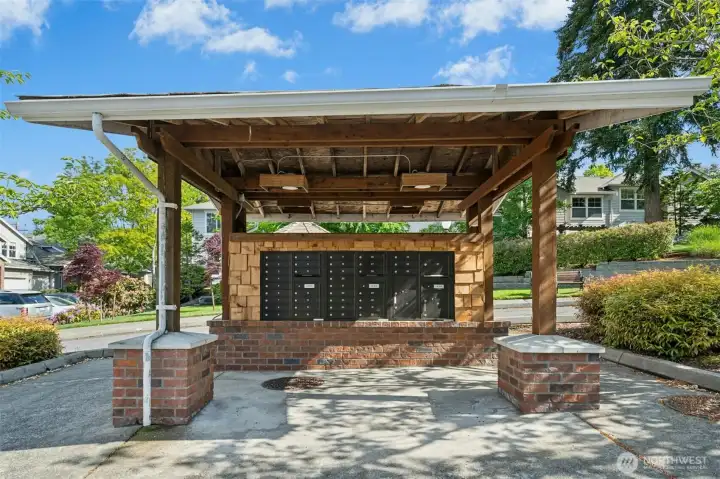 Covered community mailbox center located just adjacent to F building entry.