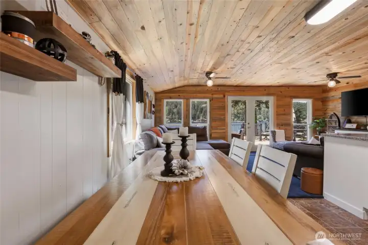 Dining table with bench, modernized touches throughout the space.