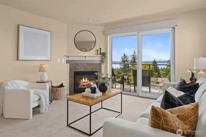 Cozy space with a gas fireplace and slider to the covered deck