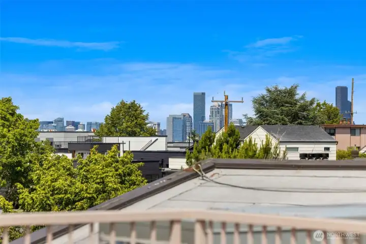 Peek view of the city from the rooftop deck