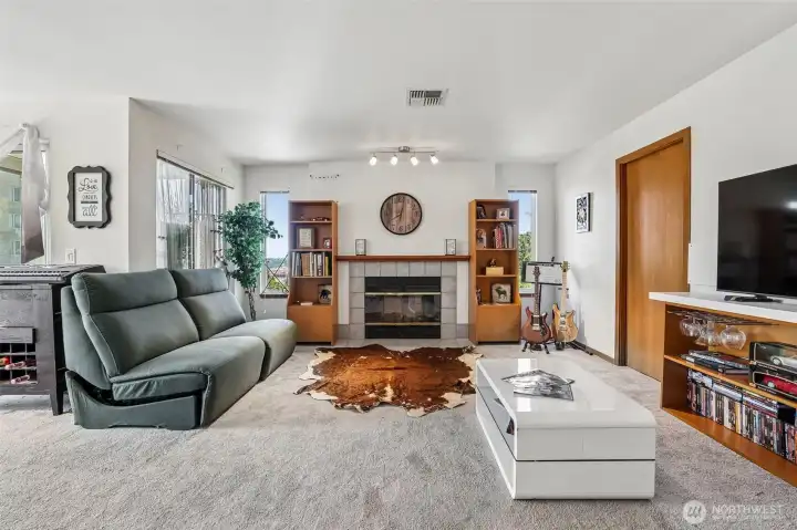 Living room w/ wood burning fireplace Living room w/ wood burning fireplace