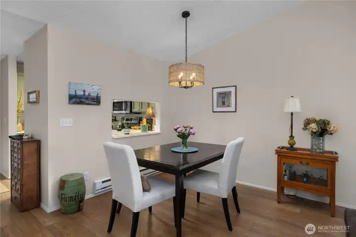Great dining space off kitchen with new light fixture.