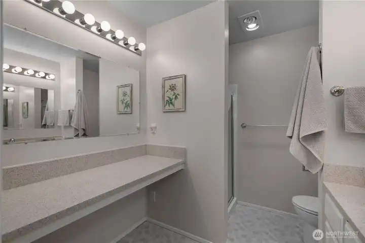 Large primary bathroom with separate counterspace.