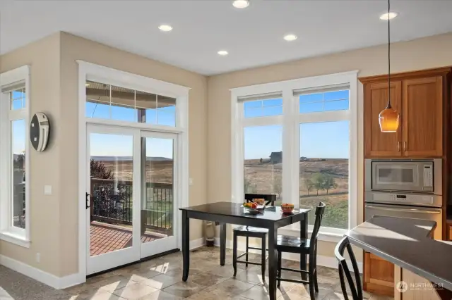 Open floor plan with dining area and eat-in bar