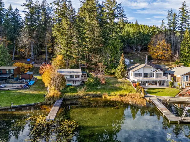 View of cabin from lake. 100 ft of Summit Lake waterfront. No bank. Dock.