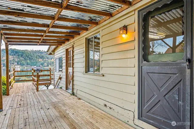 Another view; covered deck area and doors to both kitchen & living room.