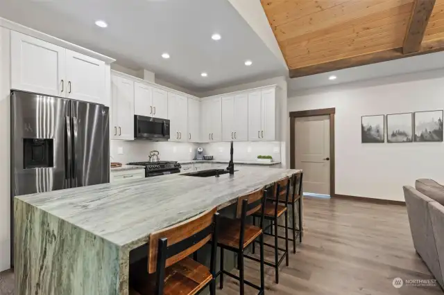 Large granite waterfall kitchen island.