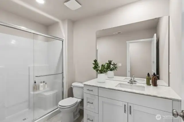 Primary Bathroom. Photos not of actual home. This is the same plan virtually staged. Plan, Colors, and options package may vary on actual home.