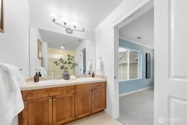 Primary ensuite bathroom with dual sinks