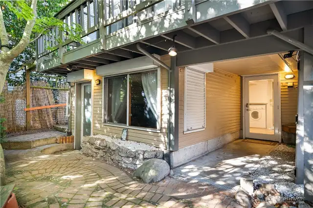 Door to 1 Bedroom Garden unit on the left. Access to 2 bedroom Artist unit through shared laundry room on the right.  Upstairs main house has its own laundry.