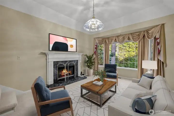 Formal living room with tray ceiling and custom wrapped natural gas fireplace. Virtually staged.