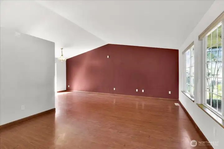 Home has open floor plan with vaulted ceilings.