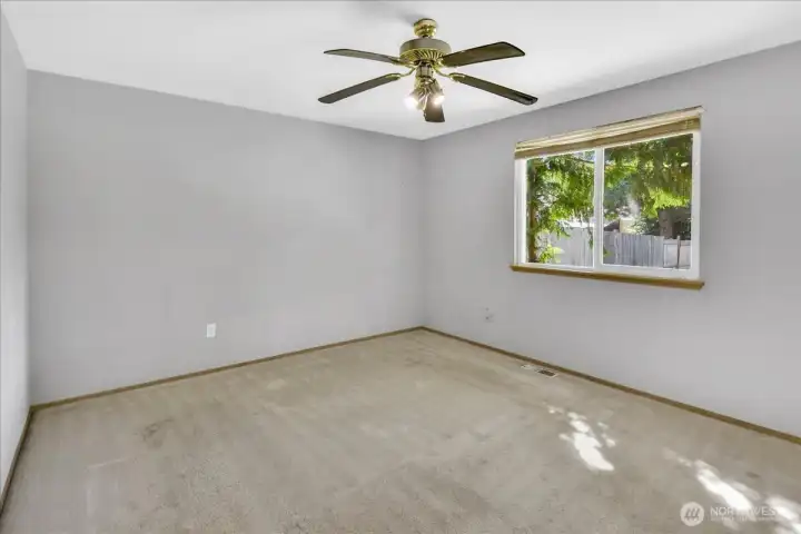 The primary bedroom can comfortably hold a king size bed along with furniture.  It is very spacious.