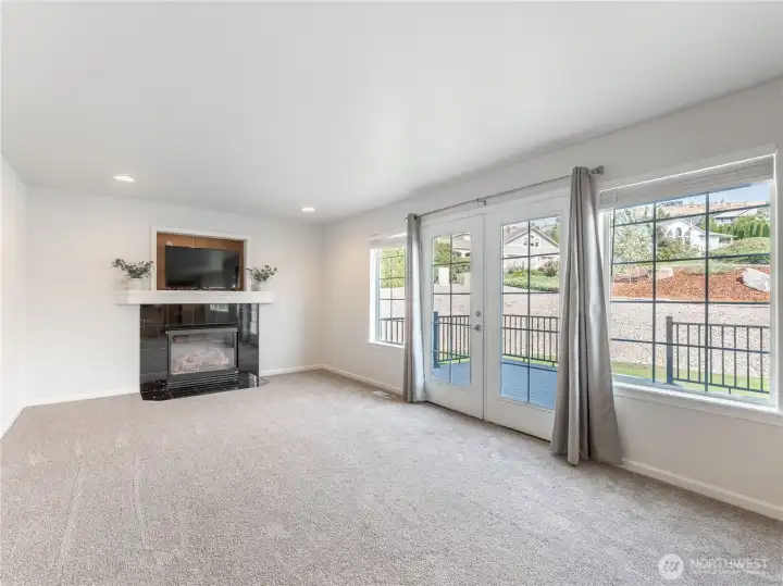 Great room w/ french doors to deck & backyard