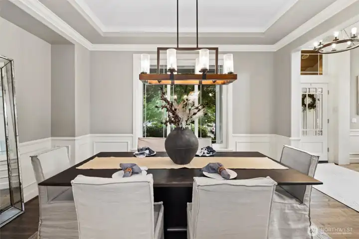 The dining room exudes timeless charm, with ample space for gatherings and a warm, inviting atmosphere that makes every meal feel special.