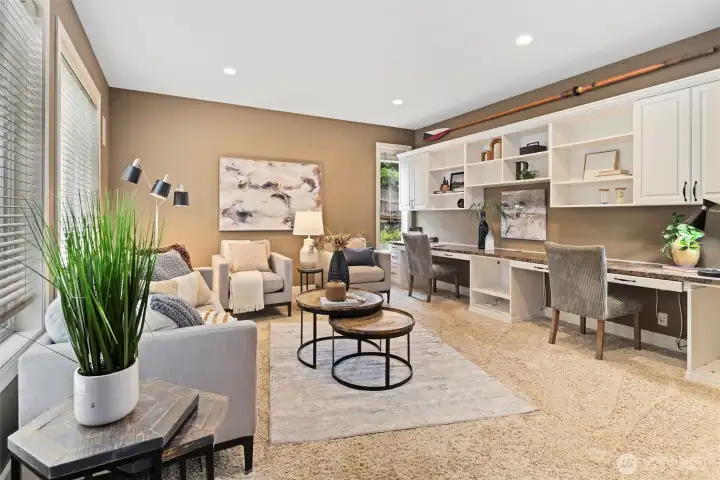 This oversized main-floor room offers the versatility to function as a spacious bedroom or rec room, with ample square footage, abundant natural light, and flexibility to fit your lifestyle needs.