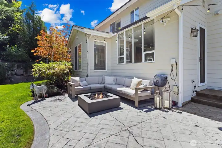 Enjoy a generously sized, private outdoor living area featuring a spacious patio. This space is ideal for entertaining, relaxing, or dining al fresco in a serene setting.
