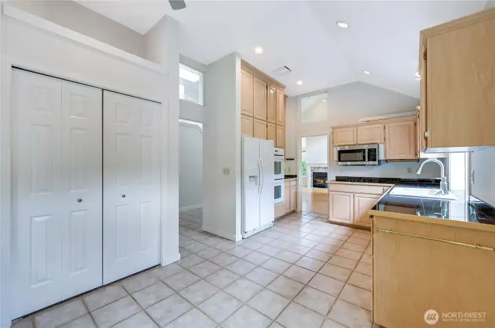 This great kitchen space offers room for a casual dining area, or for a smaller living space. the French doors on the left open to the pantry closet. Room above the doors can hold art or other items.