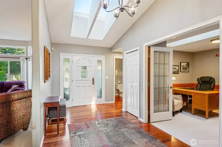 Light and bright foyer with skylights and windows.