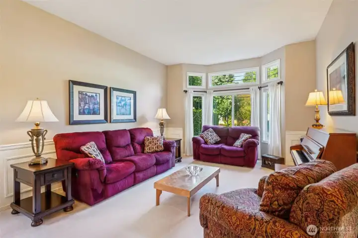 Spacious living room with large windows provide a nice view of your front yard.