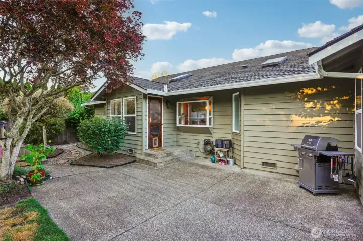 Set up the BBQ on the large patio that offers space for another seating or social area.