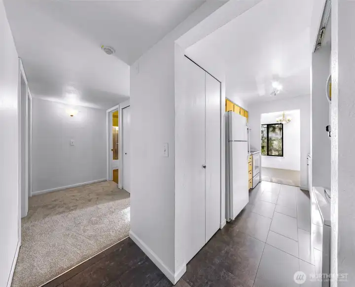 As you enter the condo, you will find fresh paint, new laminate tile, and carpet throughout.