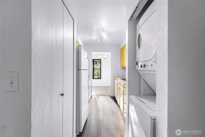 The kitchen cabinets are freshly painted and the washer and dryer stay with the unit.