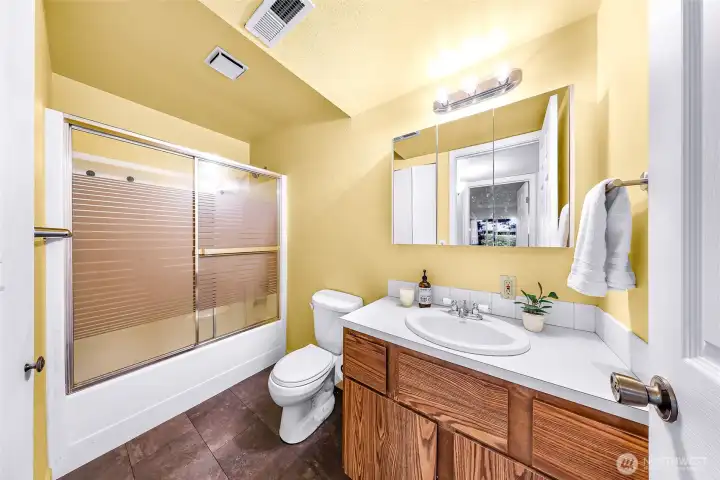 There is plenty of storage in the bathroom beneath the sink as well as a large closet to the left.